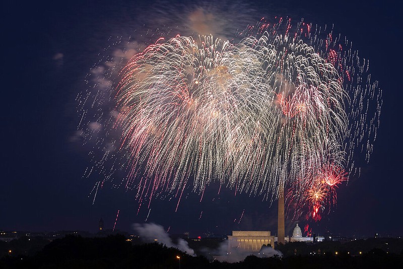 In this Saturday, July 4, 2020, file photo, Fourth of July fireworks explode over the Lincoln Memorial, the Washington Monument and the U.S. Capitol along the National Mall in Washington. President Joe Biden wants to imbue Independence Day with new meaning in 2021 by encouraging nationwide celebrations to mark the country's effective return to normalcy after 16 months of pandemic disruption. The White House says the National Mall in Washington will host the traditional fireworks ceremony and it's encouraging other communities hold festivities as well. (AP Photo/Cliff Owen, File)