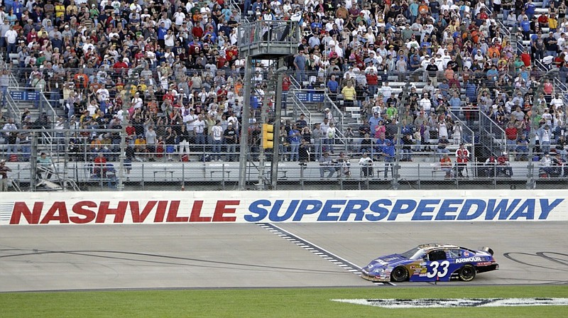 FILE -- In this April 3, 2010 file photo, Kevin Harvick takes the checkered flag at the finish line to win the NASCAR Nationwide Series Nashville 300 auto race at Nashville Superspeedway in Gladeville, Tenn. (AP Photo/Mark Humphrey, File)


