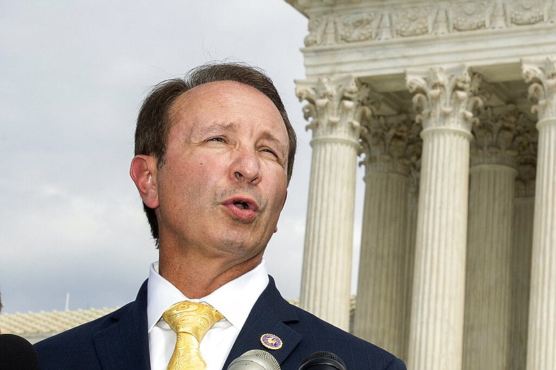 In this Sept. 9, 2019, file photo, Louisiana Attorney General Jeff Landry speaks in front of the U.S. Supreme Court in Washington. The Biden administration's suspension of new oil and gas leases on federal land and water was blocked Tuesday, June 15, 2021, by a federal judge in Louisiana. U.S. District Judge Terry Doughty's ruling came in a lawsuit filed in March by Louisiana's Republican attorney general, Jeff Landry and officials in 12 other states. Doughty's ruling granting a preliminary injunction to those states said his order applies nationwide. (AP Photo/Manuel Balce Ceneta, File)