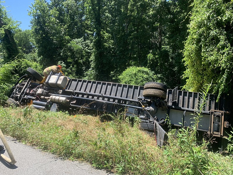 Contributed photo from the Chattanooga Fire Department / Crews worked on Tuesday, June 15, 2021, to extradite a driver whose truck overturned near S Crest Road and was hanging over the ridge.