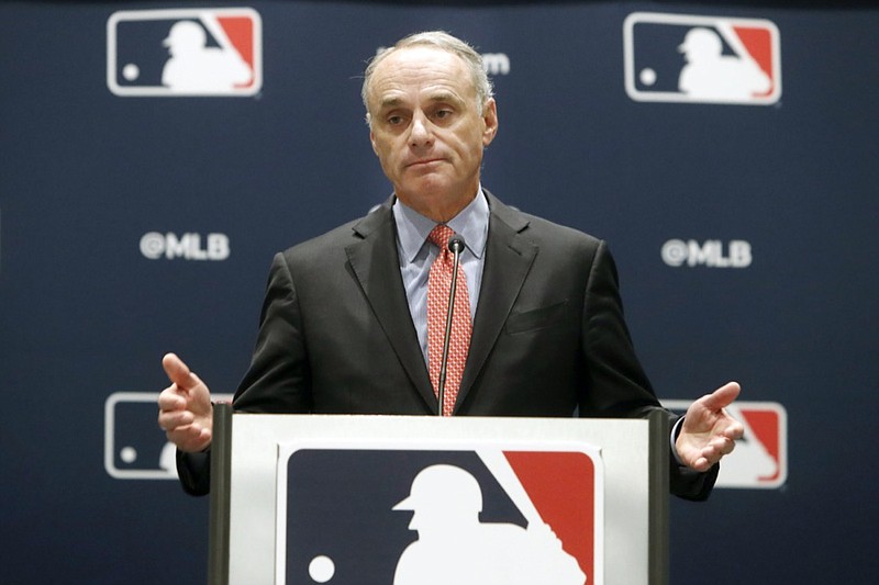 FILE - In this Nov. 21, 2019, file photo, baseball commissioner Rob Manfred speaks to the media at the owners meeting in Arlington, Texas. Pitchers will be ejected and suspended for 10 games for using illegal foreign substances to doctor baseballs in a crackdown by Major League Baseball that will start June 21. The commissioner's office, responding to record strikeouts and a league batting average at a more than half-century low, said Tuesday, June 15, 2021, that major and minor league umpires will start regular checks of all pitchers, even if opposing managers don't request inspections.(AP Photo/LM Otero, File)