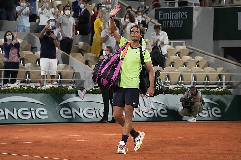 AP photo by Michel Euler / Rafael Nadal waves to spectators after losing to Novak Djokovic in their French Open semifinal last Friday in Paris.