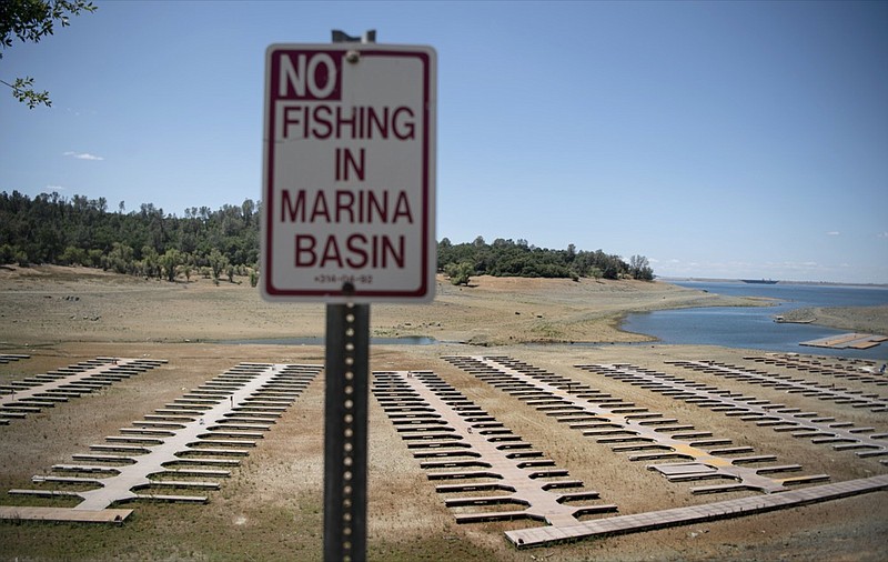 Empty boat docks sit on dry land at the Browns Ravine Cove area of drought-stricken Folsom Lake, currently at 37% of its normal capacity, in Folsom, Calif., Saturday, May 22, 2021. California Gov. Gavin Newsom declared a drought emergency for most of the state. (AP Photo/Josh Edelson)


