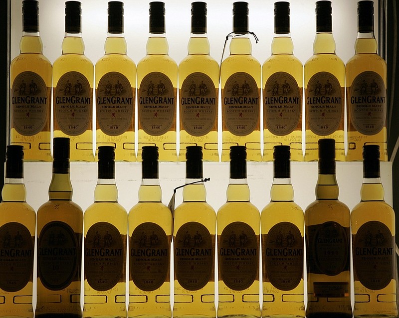 FILE- This Friday, Nov. 13, 2009, file photo, shows Scotch bottles in Cologne, Germany. (AP Photo/Hermann J. Knippertz, File)


