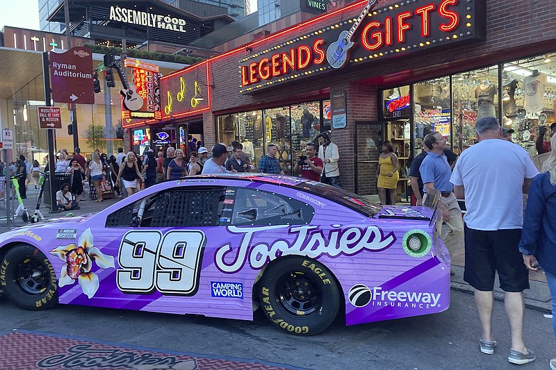 AP photo by Jenna Fryer / Trackhouse Racing's No. 99 Chevrolet, driven by Daniel Suarez and sponsored this week by Tootsie's Orchid Lounge, was parked near the iconic honky-tonk bar in Nashville on Thursday. Trackhouse owner Justin Marks plans to move the team to Nashville by 2023, and Sunday's race at Nashville Superspeedway is an important one for the organization.
