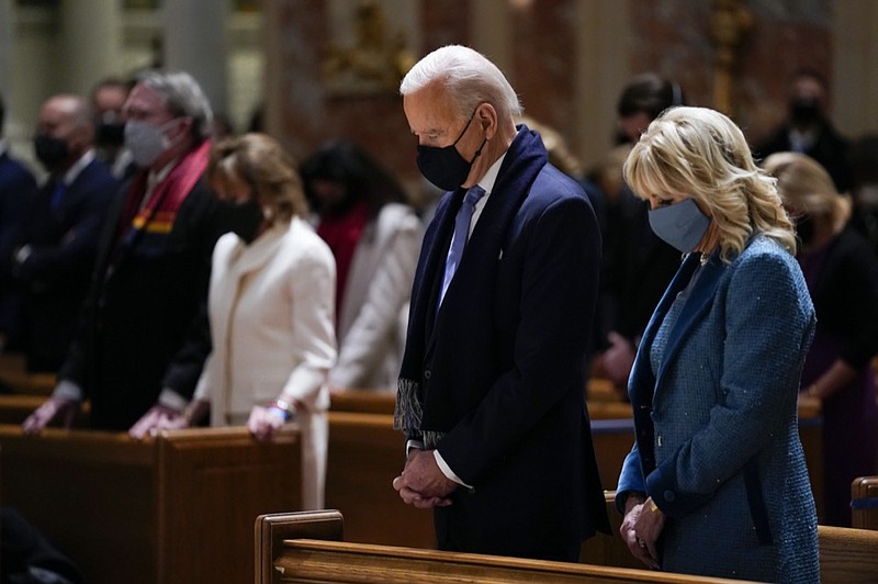 FILE - In this Wednesday, Jan. 20, 2021 file photo, President-elect Joe Biden and his wife, Jill Biden, attend Mass at the Cathedral of St. Matthew the Apostle during Inauguration Day ceremonies in Washington. (AP Photo/Evan Vucci, File)



