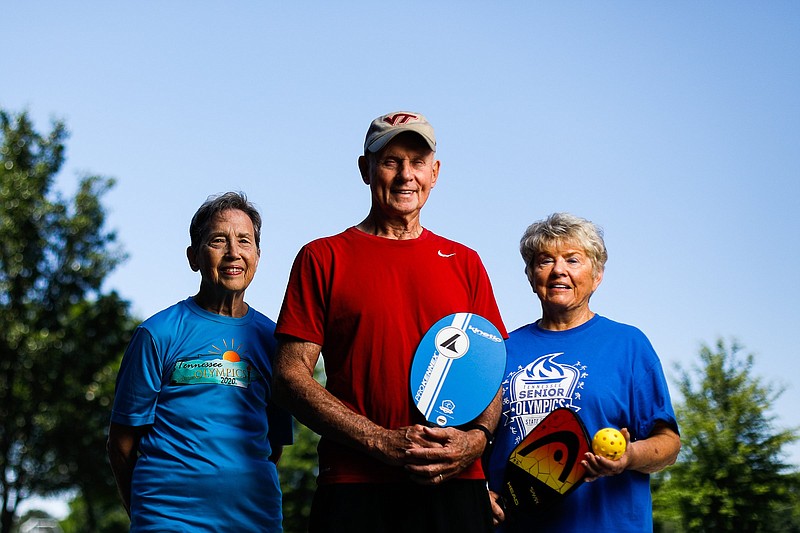 Staff photo by Troy Stolt / From left, Marilyn Beckner, Jack Painter and Patsy Duncan will take part in the Tennessee Senior Olympics pickleball competition Aug. 7-9 at the Chattanooga Convention Center. Beckner and Duncan, both 82, are a doubles team, and Duncan and Painter will compete together in mixed doubles.