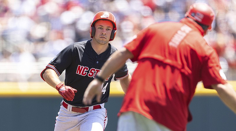 AP photo by Rebecca S. Gratz / North Carolina State's Jonny Butler, left, rounds the bases after hitting a two-run homer against Stanford in the first inning of the opening game at the College World Series on Saturday in Omaha, Neb.