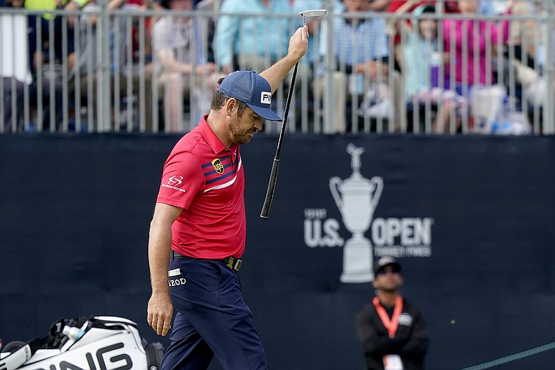 AP photo by Marcio Jose Sanchez / Louis Oosthuizen reacts after making an eagle putt on the 18th green during the third round of the U.S. Open on Saturday at Torrey Pines Golf Course in San Diego.
