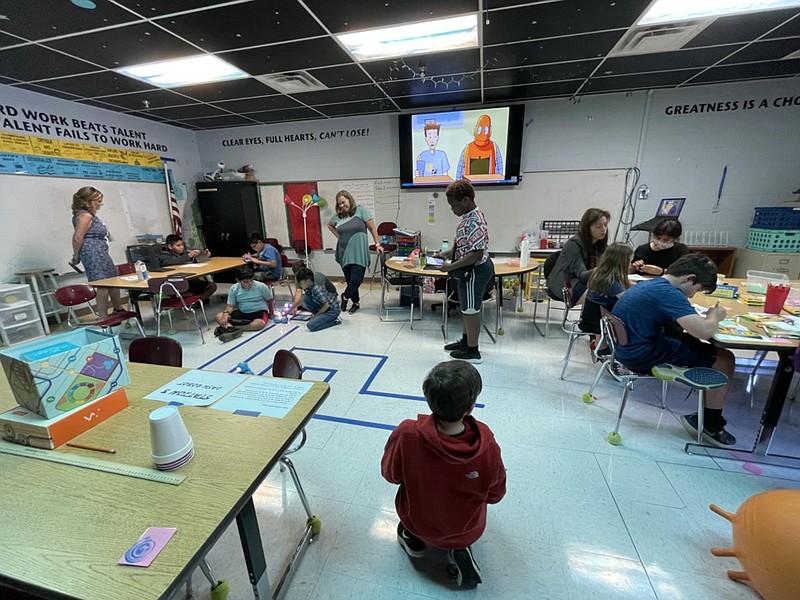 Photo by Anika Chaturvedi | Education Commissioner Penny Schwinn talks with rising sixth-grade students working with robotics during Hamilton County Schools' Summer REACH program at Red Bank Elementary School on Thursday, June 17, 2021, in Chattanooga, Tennessee.

