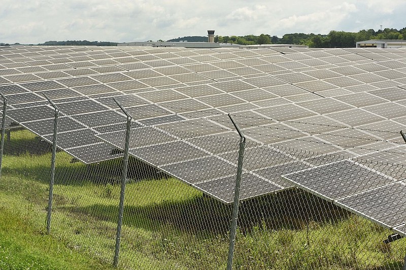 Staff file photo / Lovell Field's Federal Aviation Administration control tower is seen, top center, over dozens of panels on the solar farm at the Chattanooga Metropolitan Airport.