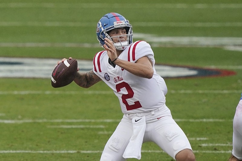 Blue quarterback Matt Corral (2) drops back to pass during the first half of The Grove Bowl, Mississippi's NCAA college spring football game, Saturday, April 24, 2021, in Oxford, Miss. The Blue team won 28-6. (AP Photo/Rogelio V. Solis)