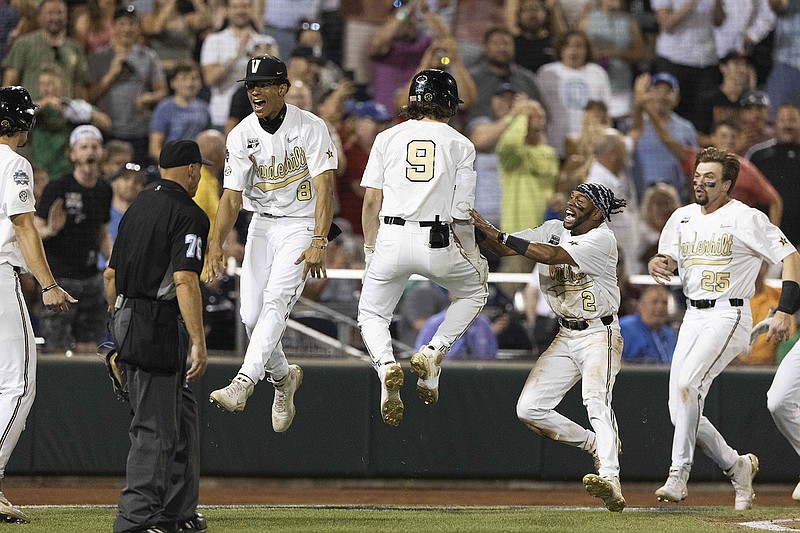 AP photo by Rebecca S. Gratz / From left, Vanderbilt's Isaiah Thomas, Carter Young, Javier Vaz and Parker Noland celebrate the Commodores' 6-5 win against Stanford on Wednesday night at the College World Series in Omaha, Neb.