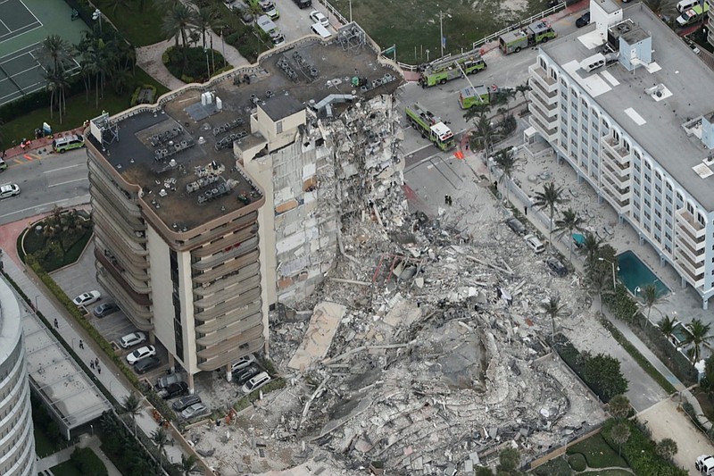 This aerial photo shows part of the 12-story oceanfront Champlain Towers South Condo that collapsed early Thursday, June 24, 2021 in Surfside, Fla. (Amy Beth Bennett /South Florida Sun-Sentinel via AP)