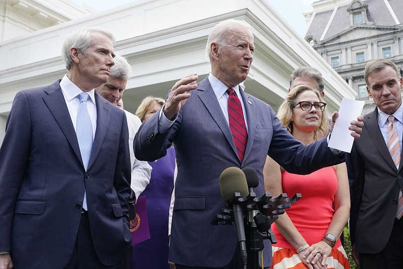 President Joe Biden, with a bipartisan group of senators, speaks Thursday June 24, 2021, outside the White House in Washington. Biden invited members of the group of 21 Republican and Democratic senators to discuss the infrastructure plan. (AP Photo/Jacquelyn Martin)