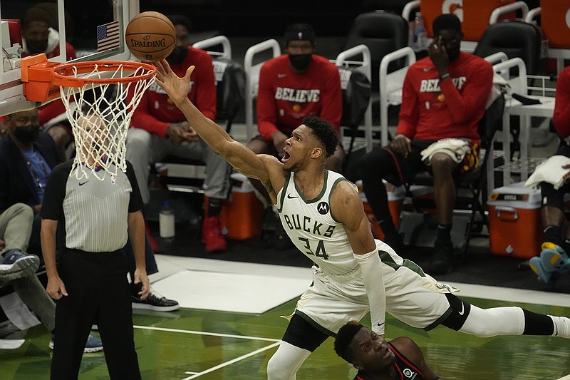 AP photo by Morry Gash / The Milwaukee Bucks' Giannis Antetokounmpo shoots over the Atlanta Hawks' Clint Capela during the second half of Game 2 of the Eastern Conference finals Friday night in Milwaukee.