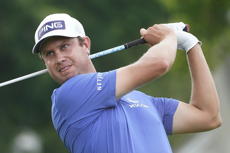 Harris English watches his shot on the third tee during the final round of the Travelers Championship golf tournament at TPC River Highlands, Sunday, June 27, 2021, in Cromwell, Conn. (AP Photo/John Minchillo)