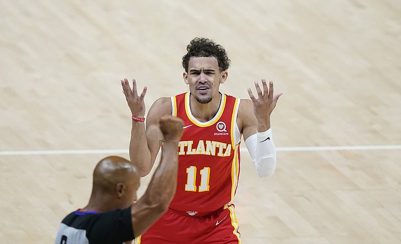 AP photo by Brynn Anderson / Atlanta Hawks point guard Trae Young disputes a foul called by a referee during the first half of Game 3 of the Eastern Conference  finals against the Milwaukee Bucks on Sunday in Atlanta.