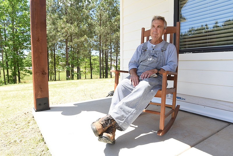 Staff Photo by Matt Hamilton / Kirk Kruse sits on his front porch at his home at Jasper Highlands in Jasper, Tenn.  on Thursday, May 13, 2021. 