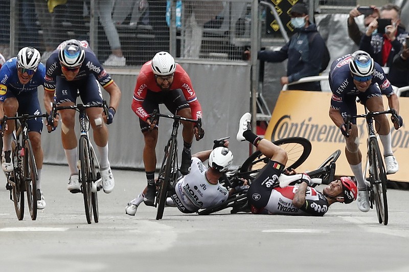 Slovakia's Peter Sagan, left, crashes with Australia's Caleb Ewan, right, during the sprint towards the finish line of the third stage of the Tour de France cycling race over 182.9 kilometers (113.65 miles) with start in Lorient and finish in Pontivy, France, Monday, June 28, 2021. (Benoit Tessier/Pool Photo via AP)