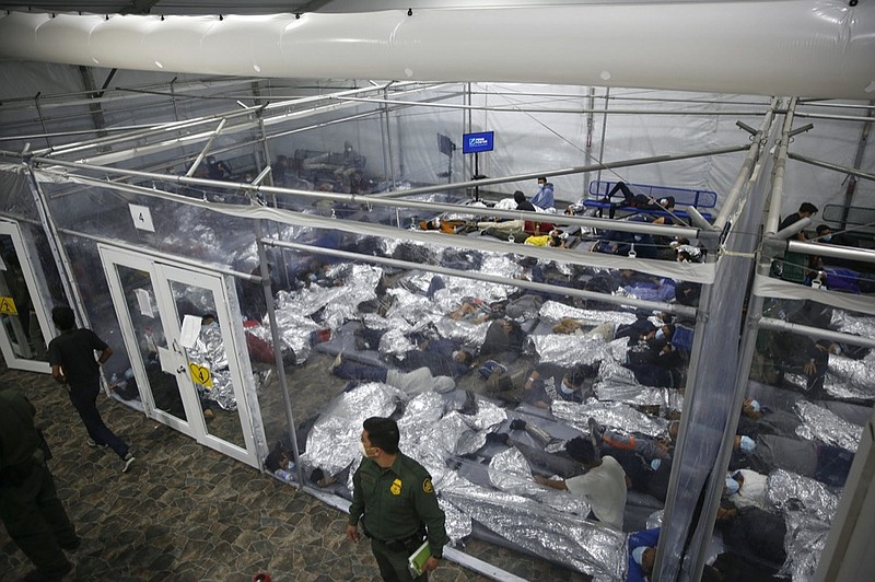 FILE - In this March 30, 2021, file photo, young minors lie inside a pod at the Donna Department of Homeland Security holding facility, the main detention center for unaccompanied children in the Rio Grande Valley run by U.S. Customs and Border Protection (CBP), in Donna, Texas. (AP Photo/Dario Lopez-Mills, Pool, File)


