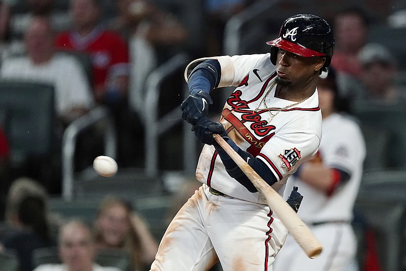 AP photo by John Bazemore / Atlanta Braves second baseman Ozzie Albies hits a single during the third inning of Wednesday's home game against the New York Mets.