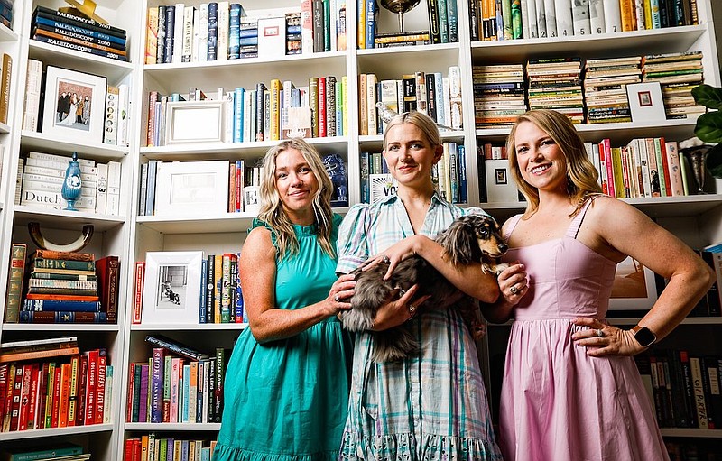 Staff photo by Troy Stolt / Blaes Green, Sarah Jackson, Emily Lilley, and her dog Bertie (middle) pose for a portrait on Monday, June 28, 2021 in Chattanooga, Tenn.