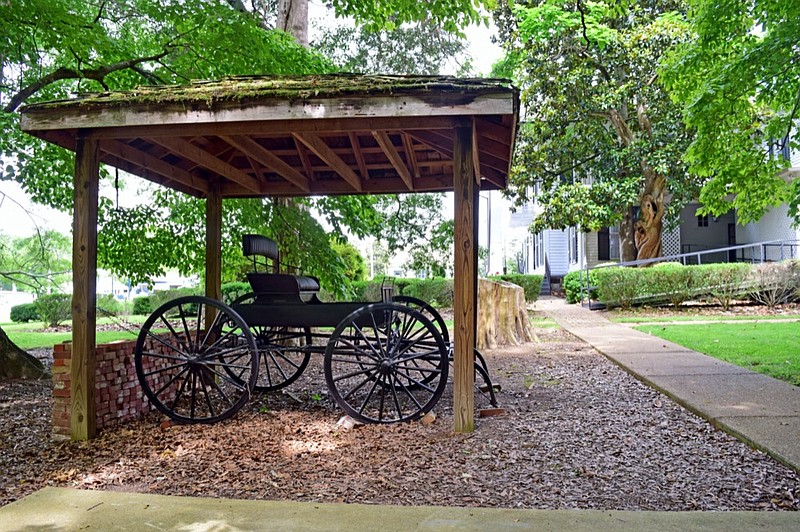 Staff Photo by Robin Rudd / A vintage carriage is preserved on the grounds of the Marsh-Warthen House, a Greek Revival mansion in LaFayette, Georgia.