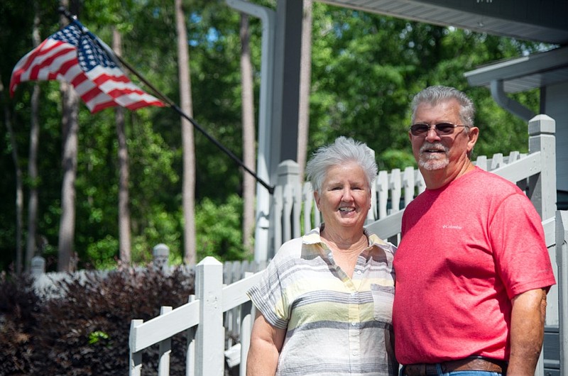 Milton and Gayle Coleman pose outside their home at Lake Sinclair June 20, 2021, in central Ga. (Jason Vorhees/The Macon Telegraph via AP)


