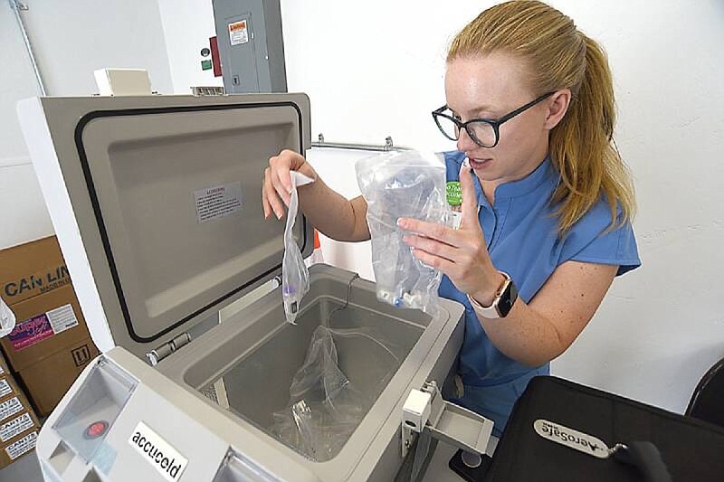 Staff Photo by Matt Hamilton / Pharmacist Jessica Duke takes inventory of the different varieties of vaccine she has available during a block party at the BlueCross Healthy Place at Highland Park in Chattanooga on Saturday, June 26, 2021.
