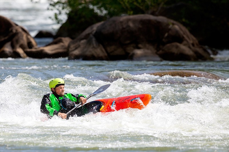 Staff photo by C.B. Schmelter / Todd Harrison works a rapid on the Middle Ocoee River on Saturday, April 25, 2020, in Polk County, Tenn.