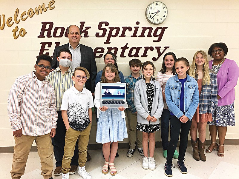 Contributed photo / Shawn Turner's fifth-grade gifted class at Rock Spring Elementary presents their findings on public interest in recycling to Walker County Board of Commissioners Chairman Shannon Whitfield.