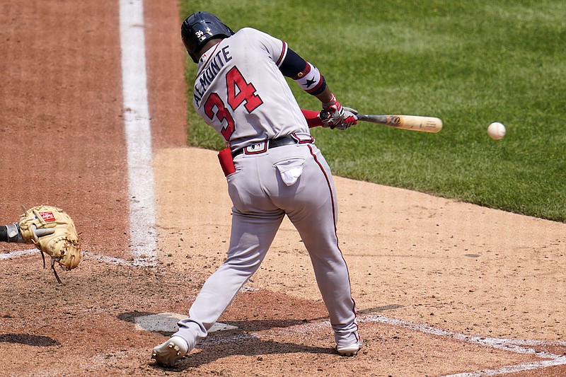 Atlanta Braves' Abraham Almonte hits a two-run single off Pittsburgh Pirates relief pitcher Kyle Crick during the sixth inning of a baseball game in Pittsburgh, Wednesday, July 7, 2021. (AP Photo/Gene J. Puskar)