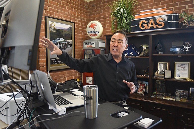 Staff Photo by Matt Hamilton / Wade Kawasaki works at his desk at the Legendary Coker Tire headquarters in Chattanooga on Wednesday, June 23, 2021.