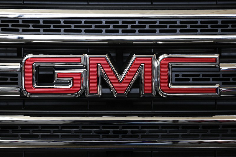 This Feb. 11, 2016 file photo shows the GMC logo on display at the Pittsburgh International Auto Show in Pittsburgh. General Motors is recalling more than 400,000 pickup trucks in the U.S. because the side air bags can explode without warning and spew parts into the cabin, Friday, July 9, 2021. The recall covers certain 2015 and 2016 Chevrolet and GMC Sierra 1500, 2500, and 3500 trucks. (AP Photo/Gene J. Puskar)