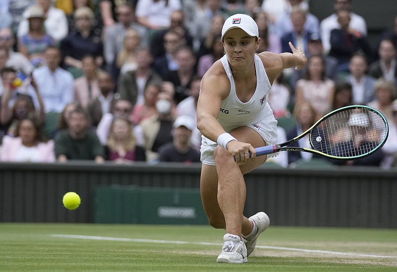 AP photo by Kirsty Wigglesworth / Australia's Ashleigh Barty plays a return to Czech Republic's Karolina Pliskova during the women's singles during the women's singles final on day twelve of the Wimbledon Tennis Championships in London, Saturday, July 10, 2021. (AP Photo/Kirsty Wigglesworth)