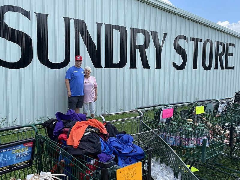 Times Free Press photo by Mark Kennedy / Dallas Ferguson, left, and his grandmother, Carol Ferguson, pose outside the family's Sundry Store in Etowah, Tennessee. The three-generation family business specializes in selling closeout merchandise.
