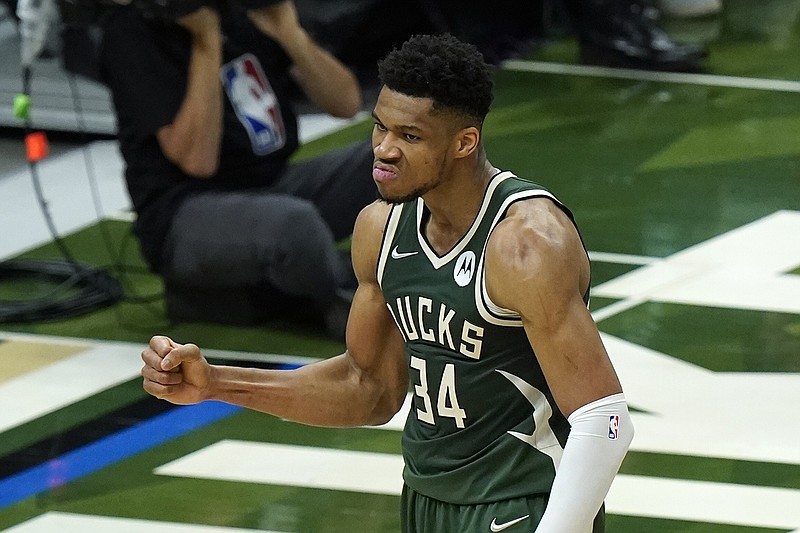 AP photo by Paul Sancya / Milwaukee Bucks forward Giannis Antetokounmpo reacts to a basket against the Phoenix Suns during Game 3 of the NBA Finals on Sunday night.