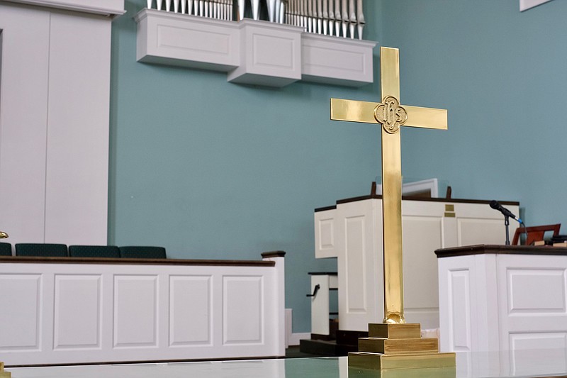 Staff photo by Wyatt Massey / A cross is pictured in the sanctuary of First Christian Church on July 11, 2021.