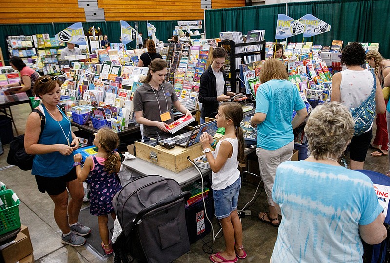 Staff photo by Doug Strickland / Parents and their children attend the Chattanooga Homeschool Expo hosted by the Chattanooga Homeschool Association at Camp Jordan Arena on Saturday, July 20, 2019, in Chattanooga, Tenn. More than 60 exhibitors were on hand to offer curriculum material and supplemental programs for homeschoolers and parents.