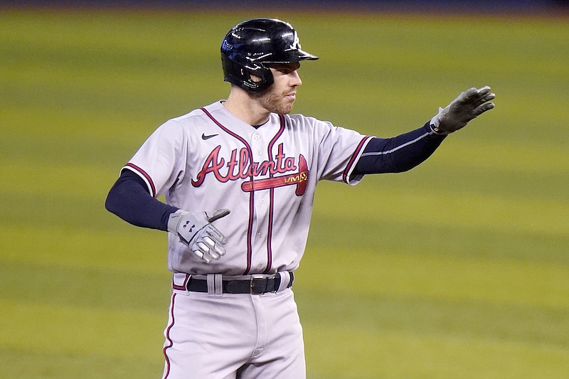 Atlanta Braves' Freddie Freeman reacts after hitting a double during the fourth inning of a baseball game against the Miami Marlins, Sunday, July 11, 2021, in Miami. (AP Photo/Lynne Sladky)