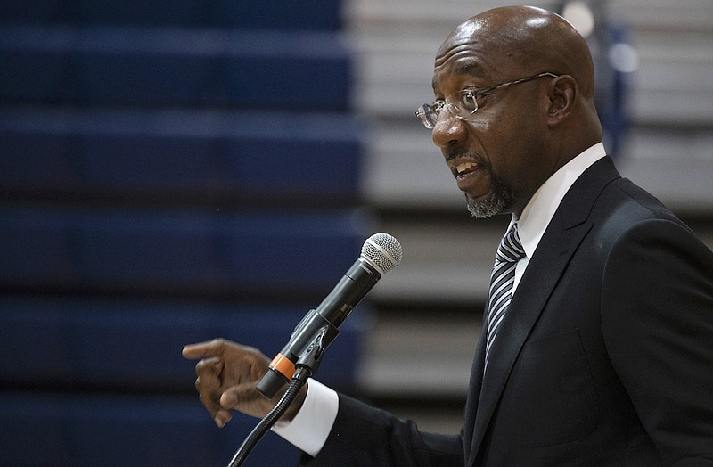 Sen. Raphael Warnock, D-Ga., speaks at Alfred E. Beach High School in Savannah, Ga., Thursday, July 8, 2021. Warnock joined fellow Democratic senators Jon Ossoff of Georgia and Tammy Baldwin of Wisconsin in introducing a bill on Monday, July 12, 2021, to require the federal government to set up a Medicaid-like health plan in states that have not expanded Medicaid plans to cover more low-income adults. (Jim Watson/Pool via AP)