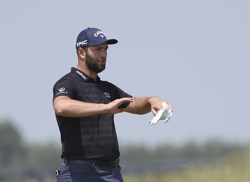 Spain's Jon Rahm gestures on the practice ground ahead of a practice round for the British Open Golf Championship at Royal St George's golf course Sandwich, England, Tuesday, July 13, 2021. The Open starts Thursday, July, 15. (AP Photo/Ian Walton)