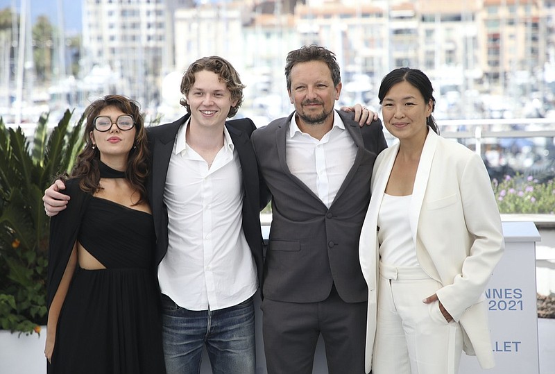 Mercedes Kilmer, from left, Jack Kilmer, director Leo Scott and director Ting Poo pose for photographers at a photo call for the film 'Val' during the 74th international film festival, Cannes, southern France, Wednesday, July 7, 2021. (Photo by Vianney Le Caer/Invision/AP)