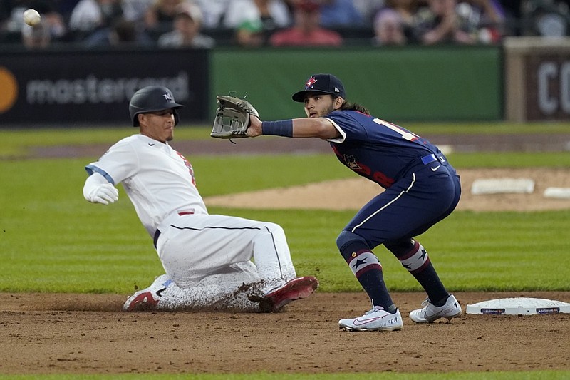 National League's Manny Machado, of the San Diego Padres, reaches second on a fielding error after a base hit as American League's Bo Bichette, of the Toronto Blue Jays, waits for the throw during the sixth inning of the MLB All-Star baseball game, Tuesday, July 13, 2021, in Denver. (AP Photo/Gabriel Christus)


