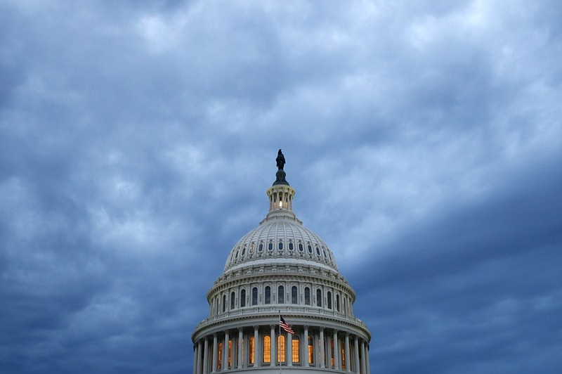 FILE - In this June 12, 2019, file photo, clouds roll over the U.S. Capitol dome as dusk approaches in Washington.  (AP Photo/Patrick Semansky, File)


