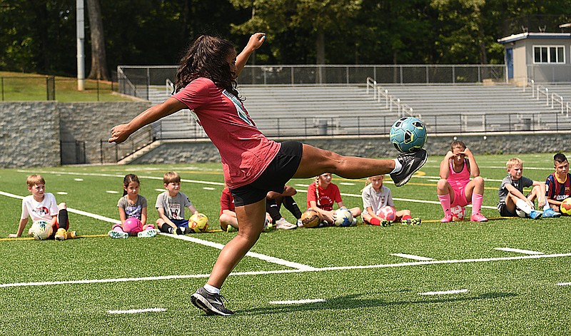 Staff photo by Matt Hamilton / Chattanooga Lady Red Wolves forward Sam DeBien shows off some moves as part of the Red Wolves Academy's Olympic-themed soccer camp July 5 at Chattanooga Christian School.