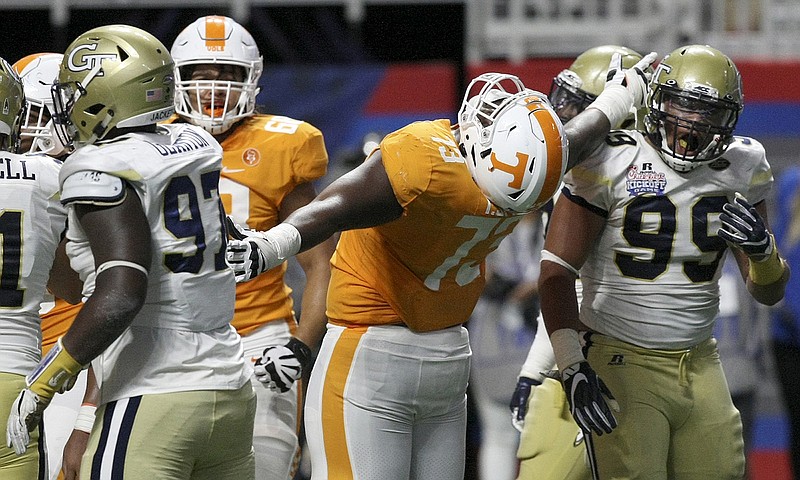 Staff photo / Tennessee offensive lineman Trey Smith (73) celebrates running back John Kelly's 2-yard touchdown run in the second overtime of the 2017 Chick-fil-A Kickoff Game win over Georgia Tech inside Atlanta's Mercedes-Benz Stadium.