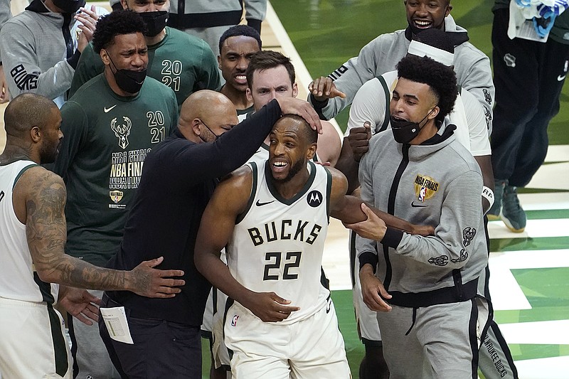 AP photo by Paul Sancya / Milwaukee Bucks forward Khris Middleton (22) celebrates with his teammates during Game 4 of the NBA Finals against the visiting Phoenix Suns on Wednesday night.