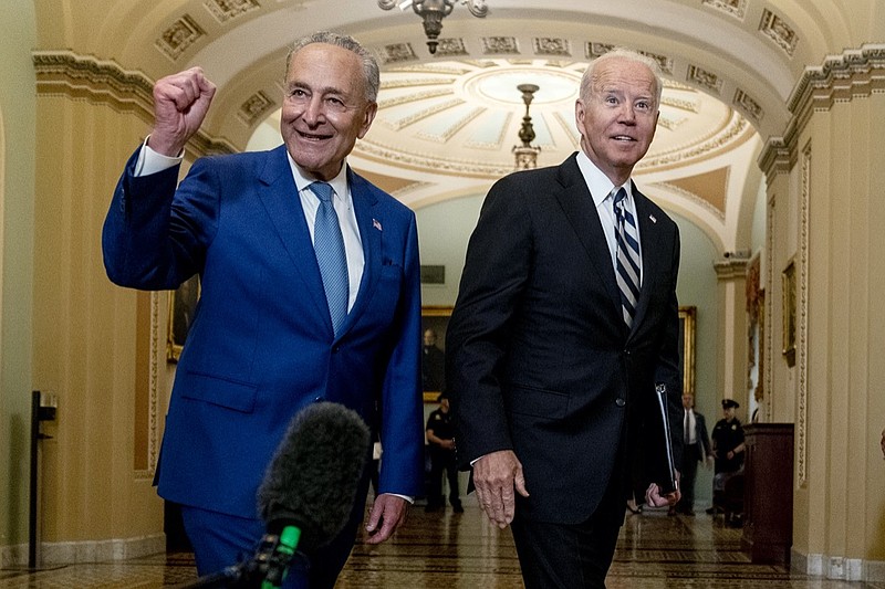 President Joe Biden joins Senate Majority Leader Chuck Schumer, D-N.Y., and fellow Democrats at the Capitol in Washington, Wednesday, July 14, 2021, to discuss the latest progress on his infrastructure agenda. (AP Photo/Andrew Harnik)